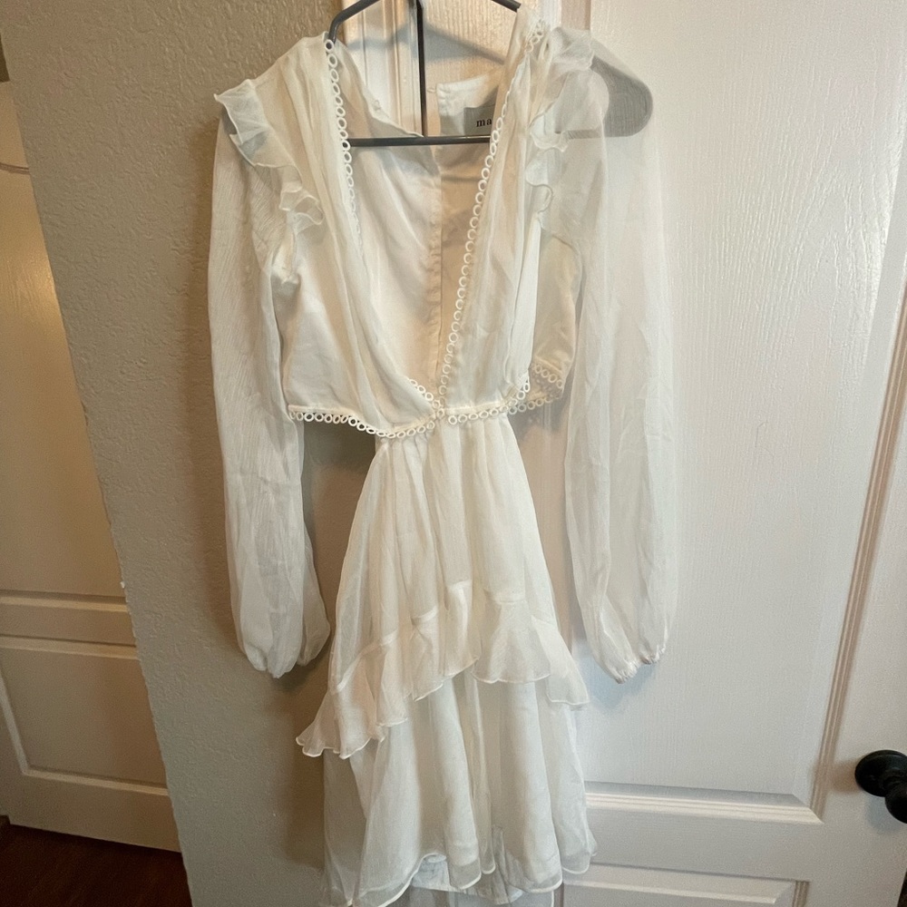 White mini dress with cut out sides and lower back